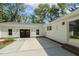 Detached garage featuring an open bay and a paved patio area at 418 S West St, Cary, NC 27511
