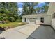 White detached garage with driveway, windows, and lush landscaping at 418 S West St, Cary, NC 27511