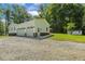 Detached three-car garage with ample parking space and additional storage at 418 S West St, Cary, NC 27511