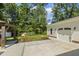 White detached garage with beautiful landscaped yard and a gazebo at 418 S West St, Cary, NC 27511