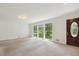 Bright living room offers a large picture window and a decorative door at 418 S West St, Cary, NC 27511