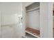 Mudroom with a built-in bench and coat rack, seamlessly flowing into the living room at 418 S West St, Cary, NC 27511