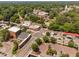 Aerial neighborhood view showing streetscape, commercial buildings, and green spaces in a bustling community at 421 Wait Ave # 100, Wake Forest, NC 27587