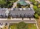 Aerial view of townhouses showing architecture, landscaping, and parking, a complete community overview at 421 Wait Ave # 100, Wake Forest, NC 27587