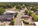 Aerial view showing commercial buildings, local businesses, and tree-lined streets in a vibrant urban area at 421 Wait Ave # 100, Wake Forest, NC 27587