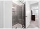 Bathroom with a tile shower and glass door, attached to the main bedroom at 421 Wait Ave # 100, Wake Forest, NC 27587