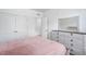 Inviting bedroom featuring white walls, neutral decor, and a view of the ensuite at 421 Wait Ave # 100, Wake Forest, NC 27587