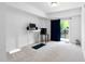 Well-lit bonus room with carpet, standing desk, and sliding door to the patio at 421 Wait Ave # 100, Wake Forest, NC 27587