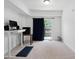 Well-lit bonus room featuring carpet, standing desk, and sliding door to the balcony at 421 Wait Ave # 100, Wake Forest, NC 27587