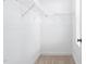 Empty walk-in closet with carpet flooring and metal shelving at 421 Wait Ave # 100, Wake Forest, NC 27587