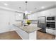 Modern kitchen with white cabinets, stainless steel appliances, and a stylish countertop at 421 Wait Ave # 100, Wake Forest, NC 27587