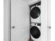 Convenient laundry closet featuring a stacked washer and dryer unit at 421 Wait Ave # 100, Wake Forest, NC 27587