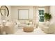 Cozy living room with a plush sectional sofa, accent chairs, and natural light from a nearby window at 43 Regal Gardens Ct, Angier, NC 27501