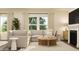 Inviting living room featuring a comfortable couch, side tables, and a fireplace for cozy relaxation at 43 Regal Gardens Ct, Angier, NC 27501