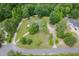 Aerial image captures mature trees surrounding this home at 4605 Malor Dr, Wake Forest, NC 27587