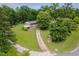 Aerial shot displays the vast lawn, brick home and well-manicured yard at 4605 Malor Dr, Wake Forest, NC 27587