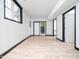 Finished basement with tile flooring, exterior access, and a closet leading to additional rooms at 4605 Malor Dr, Wake Forest, NC 27587