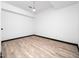 Finished basement with wood-look tile flooring and painted white walls at 4605 Malor Dr, Wake Forest, NC 27587