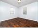 Bright bedroom features hardwood floors and two windows for lots of natural light at 4605 Malor Dr, Wake Forest, NC 27587