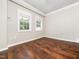 Cozy bedroom with hardwood floors, natural light, and neutral paint at 4605 Malor Dr, Wake Forest, NC 27587