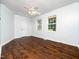 Bedroom featuring hardwood floors, fan, and two windows at 4605 Malor Dr, Wake Forest, NC 27587