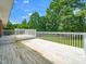 Large deck overlooking the backyard, with faded white paint at 4605 Malor Dr, Wake Forest, NC 27587