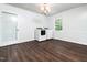 Well-lit laundry room with modern washer and dryer, hardwood floors, and fresh, neutral wall color at 4605 Malor Dr, Wake Forest, NC 27587