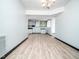 Open floor plan with a view of the kitchenette area, tile floors, and modern lighting at 4605 Malor Dr, Wake Forest, NC 27587