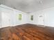 Bright living room featuring hardwood floors, natural light, and neutral paint at 4605 Malor Dr, Wake Forest, NC 27587