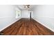 Spacious living room showcasing hardwood floors, a bay window, and neutral wall paint at 4605 Malor Dr, Wake Forest, NC 27587