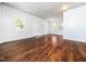 Spacious living room with hardwood floors, natural light, and white front door at 4605 Malor Dr, Wake Forest, NC 27587