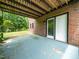Covered back patio with direct access to the backyard through sliding glass doors at 4605 Malor Dr, Wake Forest, NC 27587