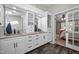 Bright and airy bathroom with double sinks, ample cabinet space, and a connecting bedroom for convenience at 4701 Governor Hunt St, Efland, NC 27243