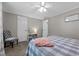 Well-lit bedroom featuring soft carpet, a ceiling fan, and a comfortable sitting area at 4701 Governor Hunt St, Efland, NC 27243
