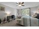 Comfortable bedroom with natural light, a ceiling fan, and a practical desk area for work or study at 4701 Governor Hunt St, Efland, NC 27243