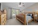 Warm and inviting bedroom featuring a wooden bed frame and rustic decor for a cozy ambiance at 4701 Governor Hunt St, Efland, NC 27243