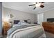 Relaxing bedroom featuring soft lighting, comfortable bedding, and ample storage space at 4701 Governor Hunt St, Efland, NC 27243
