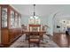 Traditional dining room with a wooden table, chairs, and a large china cabinet at 4701 Governor Hunt St, Efland, NC 27243