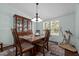Dining room with hardwood floors, a china cabinet, a dining table and chairs at 4701 Governor Hunt St, Efland, NC 27243