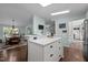 Modern kitchen showcasing an island with seating and an open view to the dining room at 4701 Governor Hunt St, Efland, NC 27243