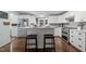 Beautiful kitchen with stainless appliances, white cabinets and countertops, and a kitchen island at 4701 Governor Hunt St, Efland, NC 27243