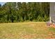 Grassy backyard view showing an air conditioning unit near the home at 474 Ashpole Trl, Clayton, NC 27520