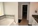 Modern bathroom with a soaking tub, tiled floor, and double vanity at 474 Ashpole Trl, Clayton, NC 27520