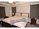 Spacious bedroom featuring a large bed, carpeted floor, and two side tables at 474 Ashpole Trl, Clayton, NC 27520