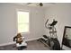 Cozy bedroom featuring carpeted floor, ample natural light, and modern ceiling fan at 474 Ashpole Trl, Clayton, NC 27520