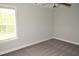Bright bedroom featuring carpeted floor, neutral walls, and a modern ceiling fan at 474 Ashpole Trl, Clayton, NC 27520
