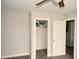 Bedroom showcasing a closet with open door, neutral walls, and carpeted floors at 474 Ashpole Trl, Clayton, NC 27520