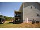 Exterior of a home showing a screened-in porch and access to the backyard at 474 Ashpole Trl, Clayton, NC 27520
