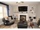 Comfortable living room with a fireplace, plush seating, and stylish decor at 474 Ashpole Trl, Clayton, NC 27520
