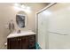 Bathroom features a single sink vanity, updated fixtures, and a glass enclosed shower at 509 Spruce Meadows Ln, Willow Springs, NC 27592